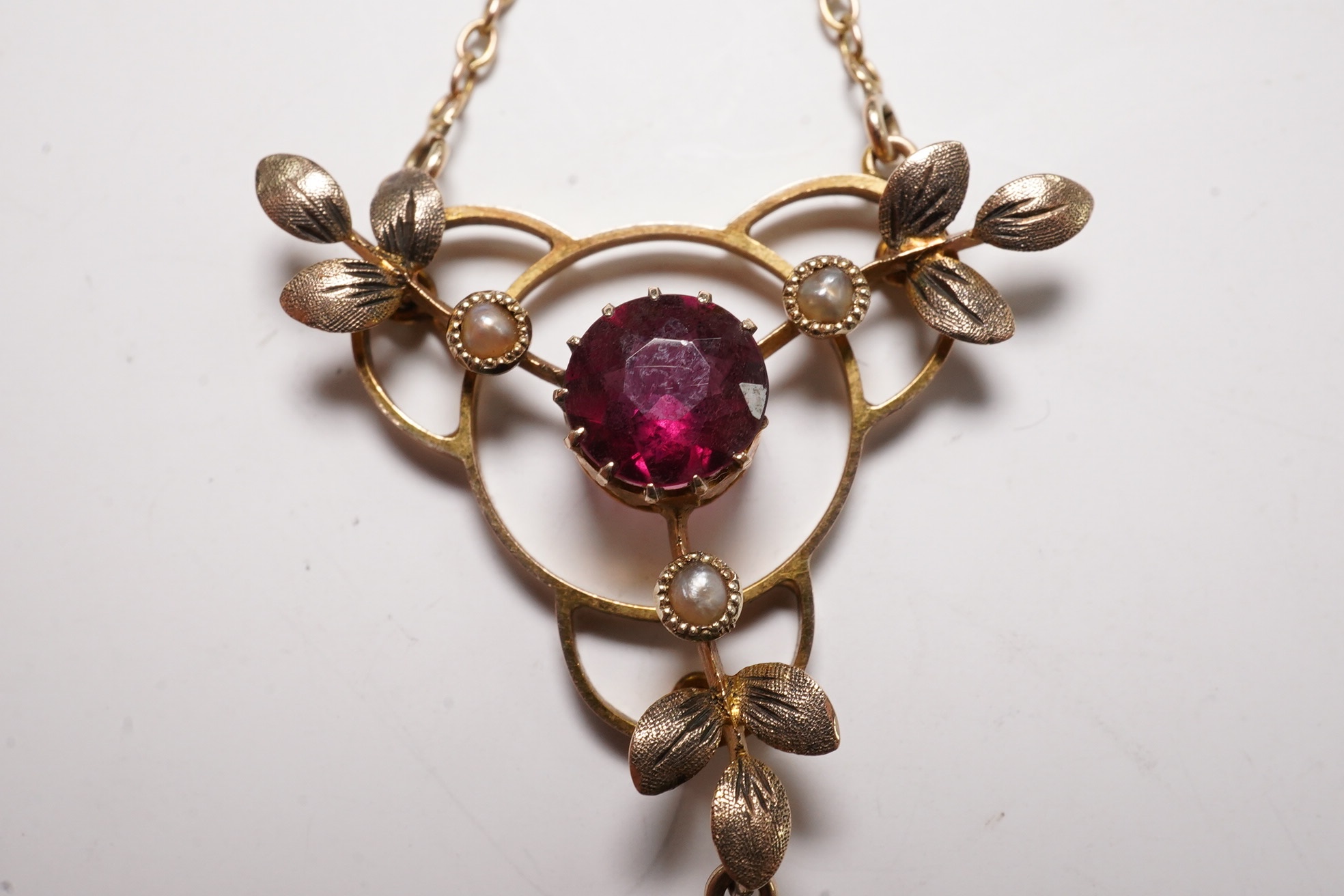 An Edwardian 9ct and gem set drop pendant necklace, pendant 43mm, chain tangled Condition - poor to fair